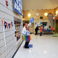 Mrs. Driver cheering on the runners